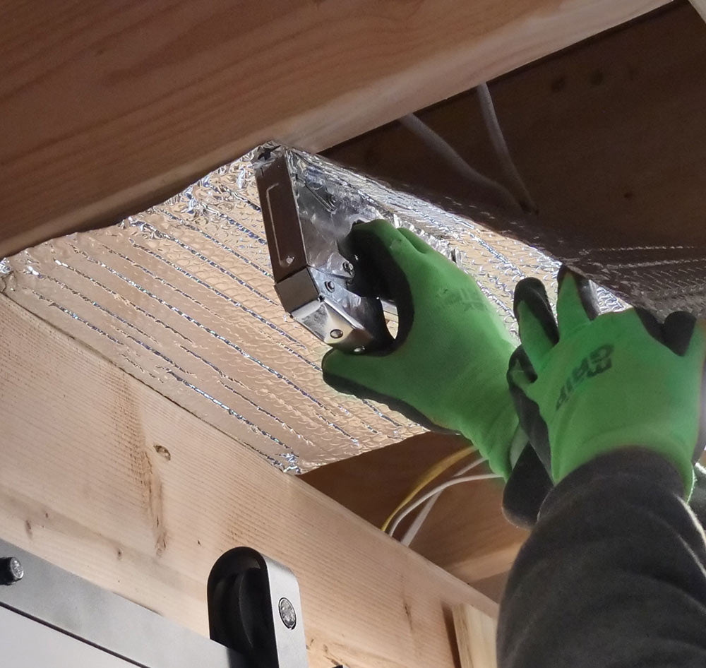 stapling reflective insulation between joists