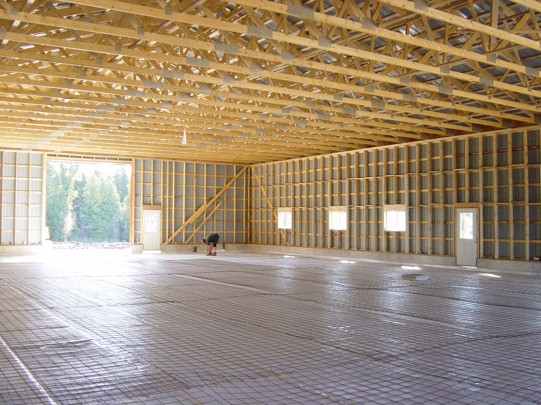 Radiant floor heating with under slab reflective insulation
