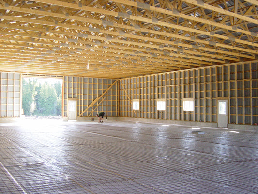 Radiant floor heating with under slab reflective insulation
