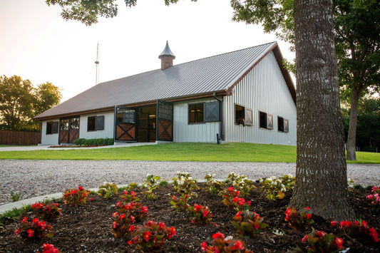 pole barn with green steel roof and white steel sides